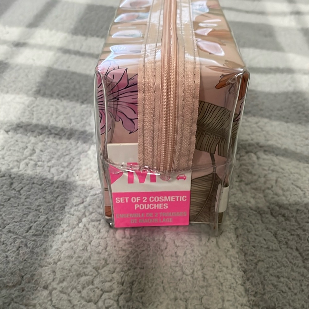 Cosmetic pouches two of a pair. Floral and clear baby soft pink color.
